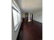 Open living room with hardwood floors and loft overlook at 16032 E Floyd Ave, Aurora, CO 80013