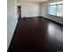 Spacious living room featuring dark hardwood floors at 16032 E Floyd Ave, Aurora, CO 80013