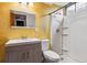 Basement bathroom with yellow walls and shower at 14830 Robins Dr, Denver, CO 80239