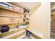 Unfinished basement with shelving, storage, and stairs at 1755 Moorwood Pt, Monument, CO 80132