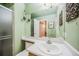 Simple bathroom, light green walls, updated vanity, and shower at 1755 Moorwood Pt, Monument, CO 80132