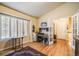 Bright home office with hardwood floors, built-in shelving and large window at 1755 Moorwood Pt, Monument, CO 80132