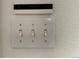 White light switches and Bang & Olufsen control panel at 2982 W Long Dr # C, Littleton, CO 80120