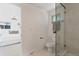 Bright bathroom with glass shower, toilet and white vanity at 34 University Dr, Longmont, CO 80503