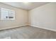 Spacious basement bedroom with neutral carpeting and large window at 684 Penn Rd, Elizabeth, CO 80107