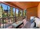 Enjoy mountain views from this cozy porch with a fire pit and seating at 654 County Road 672, Breckenridge, CO 80424