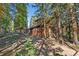 Side view of charming log cabin nestled in a wooded area at 654 County Road 672, Breckenridge, CO 80424
