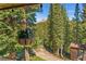 Scenic mountain view from a covered porch with hanging planters at 654 County Road 672, Breckenridge, CO 80424