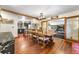 Bright dining room features a wood table with seating for six, adjacent to the kitchen at 654 County Road 672, Breckenridge, CO 80424