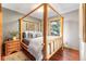 Cozy bedroom with a wooden four-poster bed and hardwood floors at 654 County Road 672, Breckenridge, CO 80424