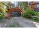 Two-car garage with a wood exterior and black garage door at 654 County Road 672, Breckenridge, CO 80424