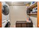 Functional laundry room with washer, dryer, and ample storage shelves at 654 County Road 672, Breckenridge, CO 80424