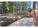 Private backyard patio with stonework and seating area at 654 County Road 672, Breckenridge, CO 80424