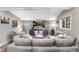 Relaxing living room with sectional sofa, large TV, and mountain views at 654 County Road 672, Breckenridge, CO 80424
