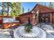 Relaxing patio with hot tub, stone table, and chairs at 654 County Road 672, Breckenridge, CO 80424