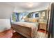 Spacious main bedroom with a sleigh bed and wood floors at 654 County Road 672, Breckenridge, CO 80424