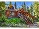 Rustic mountain home with wooden exterior and stairs at 654 County Road 672, Breckenridge, CO 80424