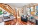 Bright living room with hardwood floors, comfortable seating, and a staircase at 654 County Road 672, Breckenridge, CO 80424