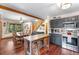 Modern kitchen with dark gray cabinets, stainless steel appliances, and an island at 654 County Road 672, Breckenridge, CO 80424