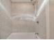 Updated shower with grey tile and handheld shower head at 824 W Geddes Cir, Littleton, CO 80120