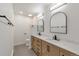Elegant bathroom with double vanity and arched mirrors at 824 W Geddes Cir, Littleton, CO 80120