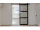 Barn door leading to additional space at 824 W Geddes Cir, Littleton, CO 80120