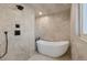 Spa-like bathroom featuring a large soaking tub and walk-in shower at 824 W Geddes Cir, Littleton, CO 80120