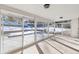 Bright three-season room with sliding glass doors and views of the backyard at 824 W Geddes Cir, Littleton, CO 80120
