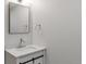 Basement bathroom with a vanity and mirror at 824 W Geddes Cir, Littleton, CO 80120