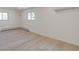 Simple bedroom with light wood floors and two windows at 824 W Geddes Cir, Littleton, CO 80120