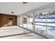 Bright three-season room with sliding glass doors offering backyard access at 824 W Geddes Cir, Littleton, CO 80120