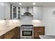 Updated kitchen with stainless steel appliances and white shaker cabinets at 824 W Geddes Cir, Littleton, CO 80120