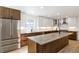 Modern kitchen with stainless steel appliances and large island at 824 W Geddes Cir, Littleton, CO 80120