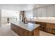 Modern kitchen with large island and stainless steel appliances at 824 W Geddes Cir, Littleton, CO 80120