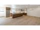 Open concept kitchen with light wood cabinets at 824 W Geddes Cir, Littleton, CO 80120