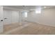 Finished basement with neutral carpet and ample space at 824 W Geddes Cir, Littleton, CO 80120