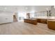 Light and airy living room with hardwood floors and kitchen view at 824 W Geddes Cir, Littleton, CO 80120
