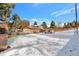 Aerial view shows a home with a large backyard, shed, and detached garage at 824 W Geddes Cir, Littleton, CO 80120