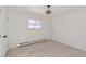 Spacious bedroom with light wood floors and large window at 824 W Geddes Cir, Littleton, CO 80120