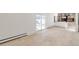 Finished basement room with hardwood floors and access to backyard at 824 W Geddes Cir, Littleton, CO 80120