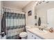 Clean bathroom with shower/tub combo, toilet and vanity at 19608 E 58Th Pl, Aurora, CO 80019