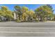 Apartment building exterior with mature trees and landscaping at 3184 S Heather Gardens Way # 302, Aurora, CO 80014
