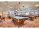 Game room featuring multiple billiard tables and comfortable seating at 3184 S Heather Gardens Way # 302, Aurora, CO 80014