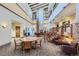 Bright and airy lobby with comfortable seating and fireplace at 3184 S Heather Gardens Way # 302, Aurora, CO 80014