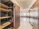 Shared storage area with individual units and shelving at 3184 S Heather Gardens Way # 302, Aurora, CO 80014