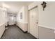 Building hallway with carpet, exit, and apartment door at 3184 S Heather Gardens Way # 302, Aurora, CO 80014