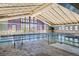 Indoor pool area with large windows and accessible entry at 3184 S Heather Gardens Way # 302, Aurora, CO 80014