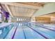 Indoor lap pool with multiple lanes and spacious deck at 3184 S Heather Gardens Way # 302, Aurora, CO 80014