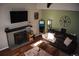 Bright living room with fireplace, wood floors, and a high ceiling at 5411 E Courtney Ave, Castle Rock, CO 80104