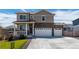 Two-story house with a two-car garage and landscaped front yard at 8378 E 132Nd Pl, Thornton, CO 80602